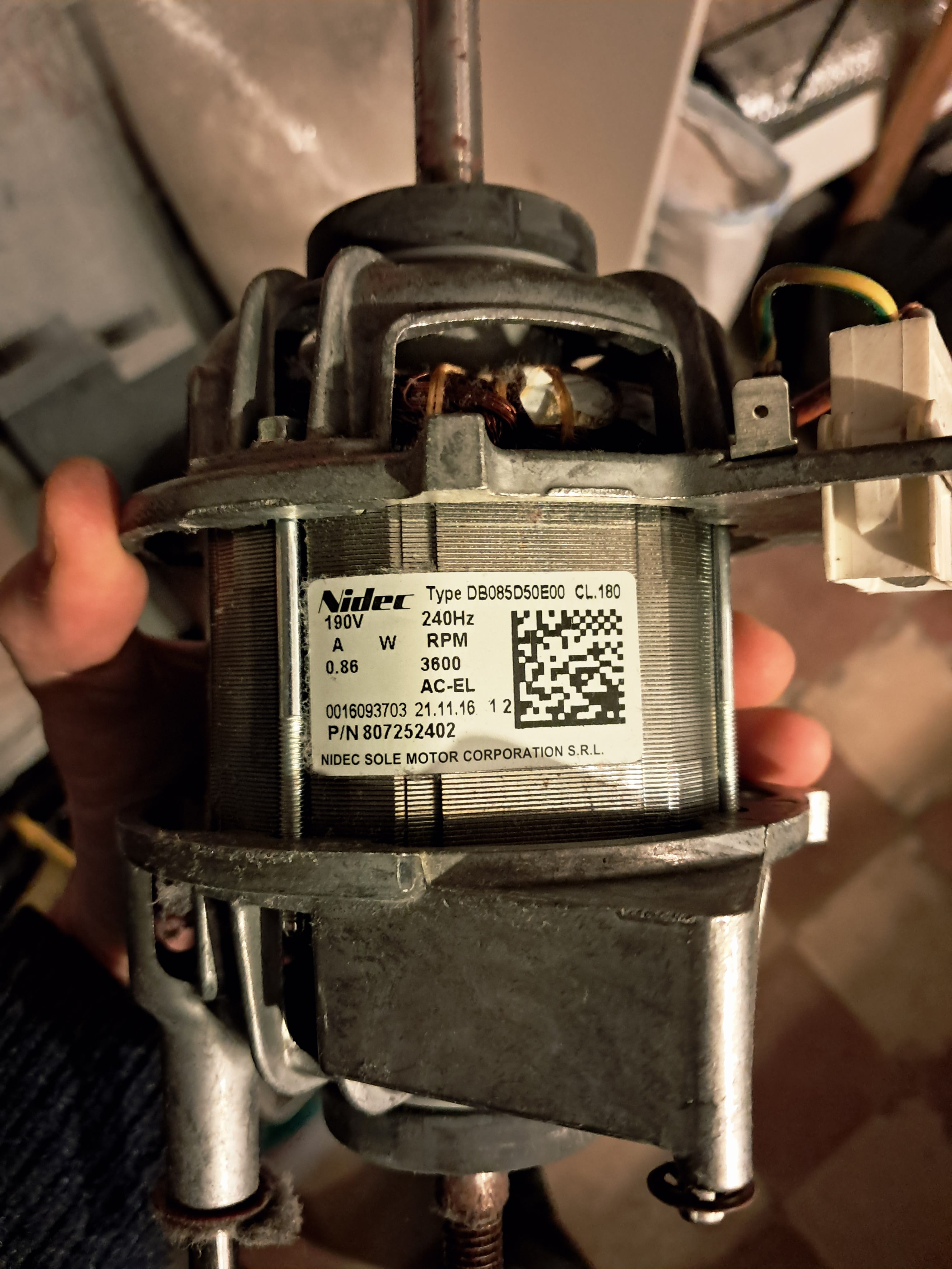 Nidec motor with visible nameplate showing type DB085D50E00